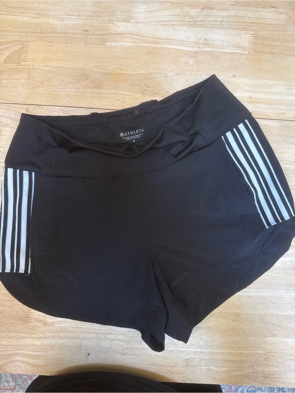 Athleta Black Athletic Shorts with White Stripe Panels